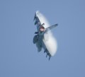 F16 Fighting Falcon pulling vapor with afterburner