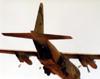 C130 Hercules flying with loadmaster at open ramp