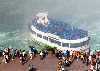 Maid of the Mist and people standing on the Canadian side of the Falls